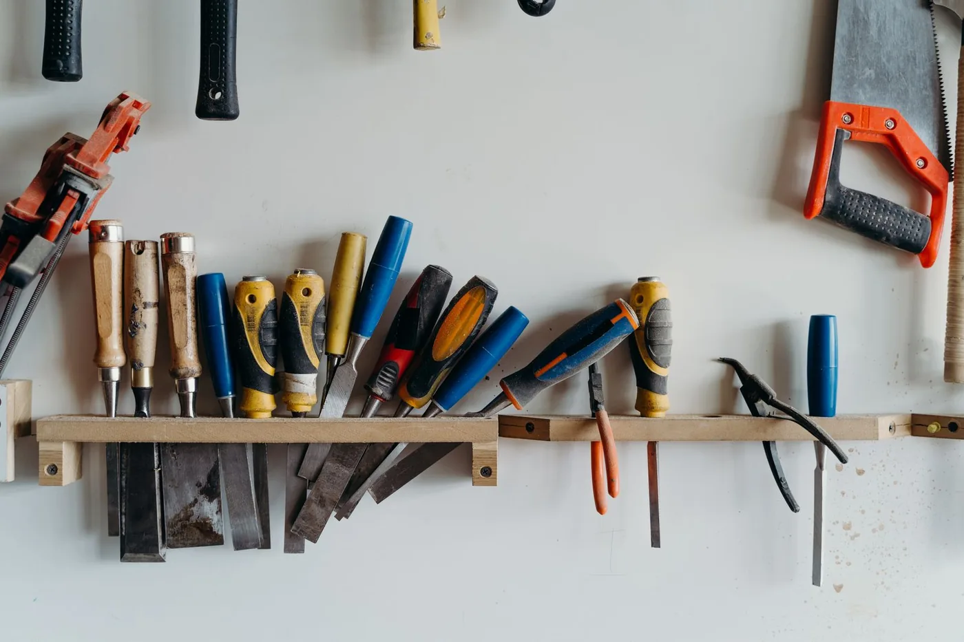 Carpenter trade tools laid out on a workshop bench