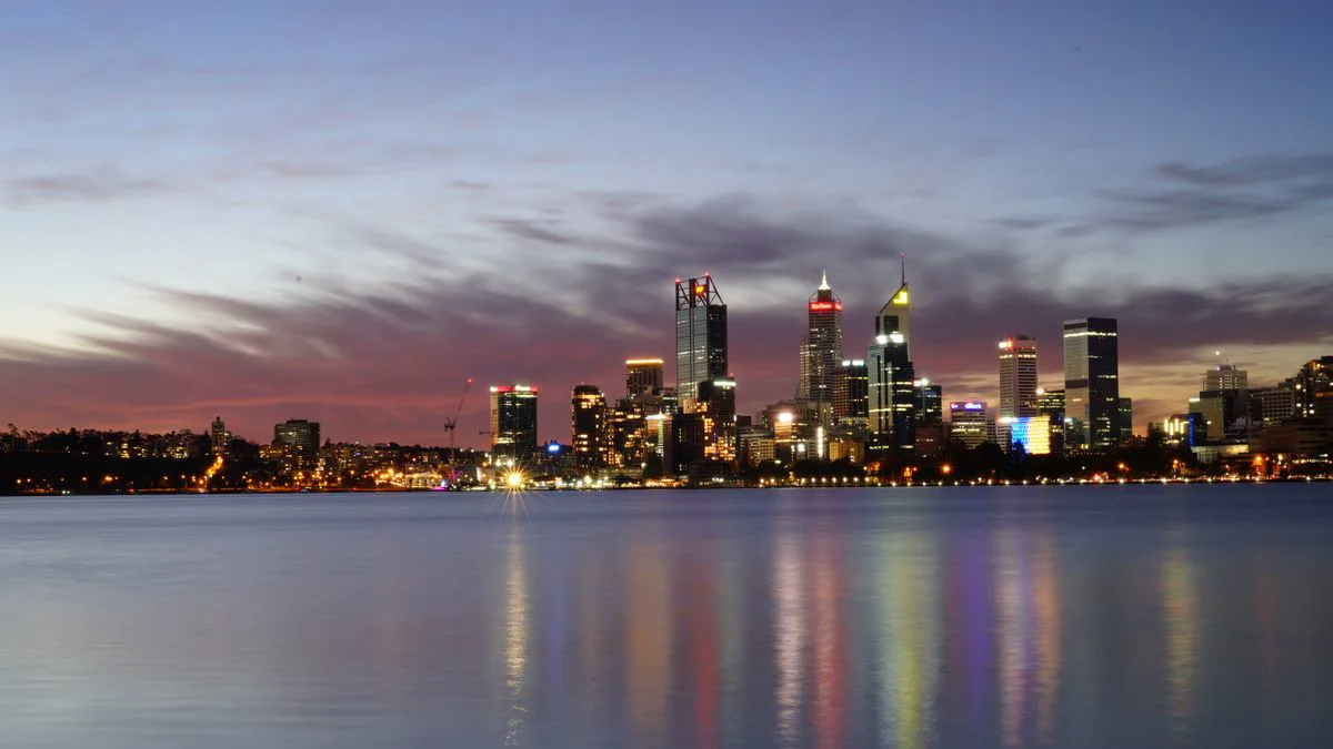 Perth city skyline across the Swan River at dusk